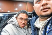 1765883102592-youtuber-muhammad-adimas-diperiksa-polda-jabar-usai-ditangkap-di-semarang-1765854541939_169